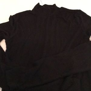 A black long sleeve mock neck shirt